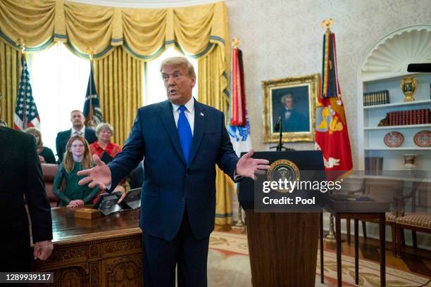 President Donald Trump presents the Presidential Medal of Freedom to Dan Gable in the Oval Office on December 07, 2020 in Washington, DC. Gable is a...