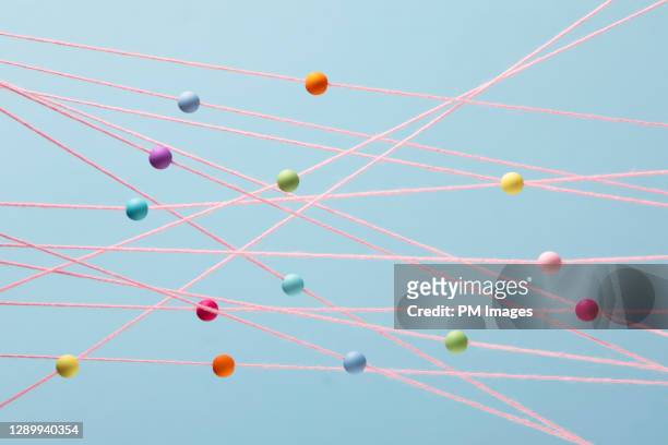 random multi colored beads on strings - stock photo - strategic direction stock pictures, royalty-free photos & images