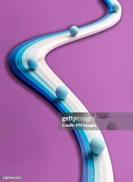 abstract - blue balls on paper path - follow the leader stock pictures, royalty-free photos & images