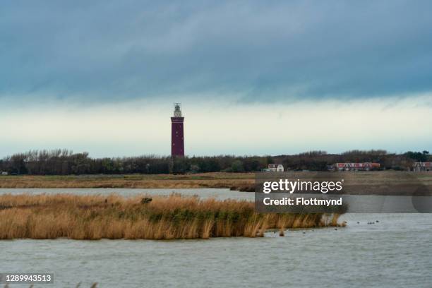 lighthouse in ouddorp called westhoofd, build in 1950 out of concrete and bricks. - south holland ストックフォトと画像