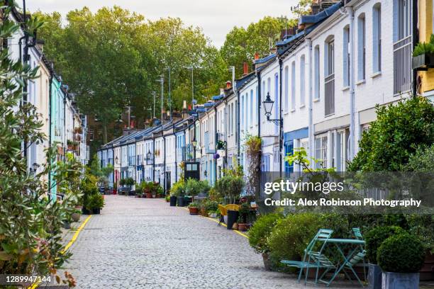 a london mews - residential street of colourful houses once used for stables and coach houses - kensington stock pictures, royalty-free photos & images