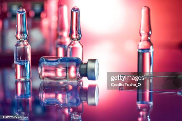 close up of syringe in laboratory - flu shot and covid-19 vaccine - stock photo - covid 19 vaccine vial stock pictures, royalty-free photos & images