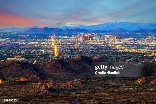 phoenix, arizona skyline at dusk - phoenix arizona aerial stock pictures, royalty-free photos & images