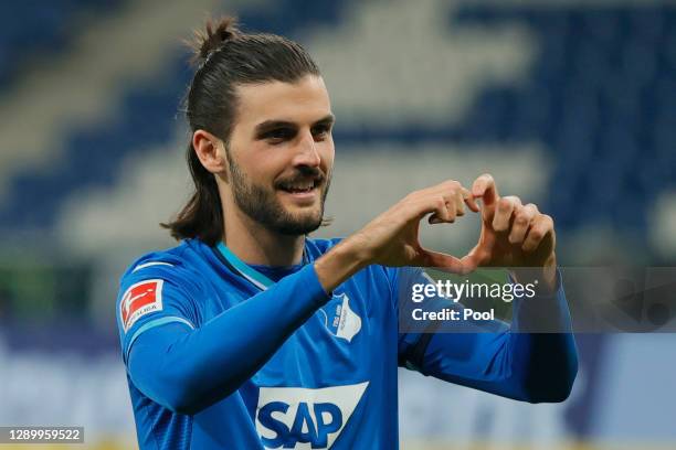 Florian Grillitsch of Hoffenheim celebrates his team's second goal during the Bundesliga match between TSG Hoffenheim and FC Augsburg at...