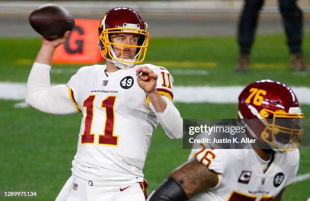 Alex Smith of the Washington Football Team looks to pass during the first quarter of their game against the Pittsburgh Steelers at Heinz Field on...