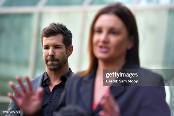 Former Special Air Service Regiment soldier Heston Russell listens as Senator Jacqui Lambie addresses media in the Senate Courtyard at Parliament...