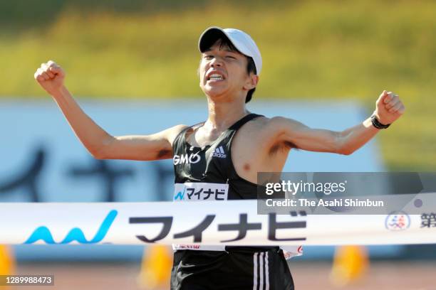 Yuya Yoshida crosses the finish tape to win the 74th Fukuoka International Marathon at the Heiwadai Athletic Stadium on December 6, 2020 in Fukuoka,...