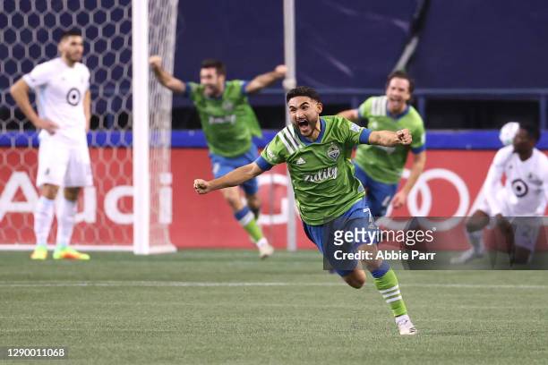 Cristian Roldan of Seattle Sounders celebrates a goal by Gustav Svensson in the 93rd minute against Minnesota United during their Western Conference...