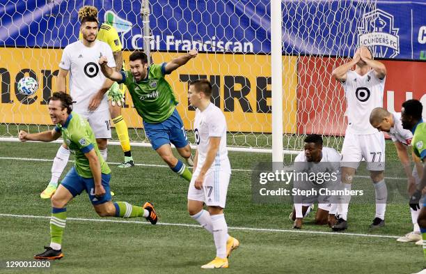 Gustav Svensson of Seattle Sounders and Will Bruin celebrate the winning goal against the Minnesota United in the second half during the Western...