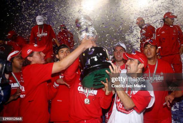 Mario Mendez, Ariel Rosada and Vicente Sanchez of Toluca celebrate the championship title after defeating Monterrey during the final match of the...