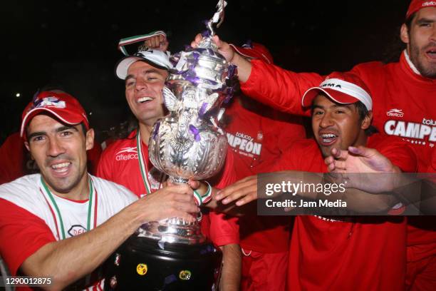 Ariel Rosada, Vicente Sanchez and Manuel de la Torre of Toluca celebrate the championship title after defeating Monterrey during the final match of...