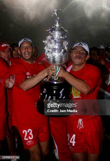 Jose Manuel Abundis and Jose Manuel Cruzalta of Toluca celebrate the championship title after defeating Monterrey during the final match of the...