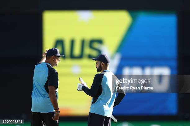 Virat Kohli of India speaks to Ravi Shastri, Head Coach of India, before game three of the Twenty20 International series between Australia and India...