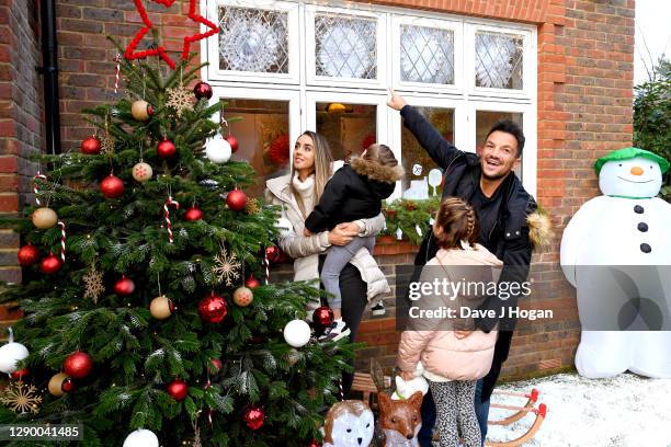 Peter Andre and Emily MacDonagh decorate their Christmas tree and windows as part of the The Snowman Winter Windows Campaign on December 06, 2020 in...