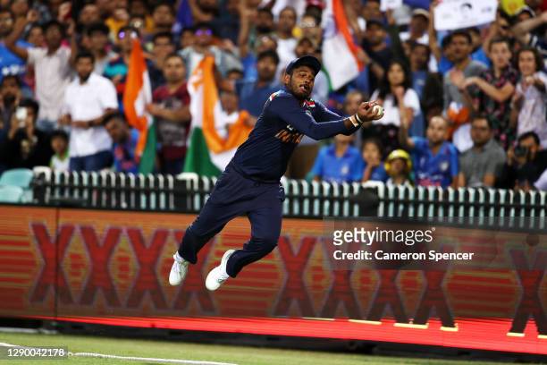 Sanju Samson of India catches Glenn Maxwell of Australia beyond the boundary rope during game three of the Twenty20 International series between...