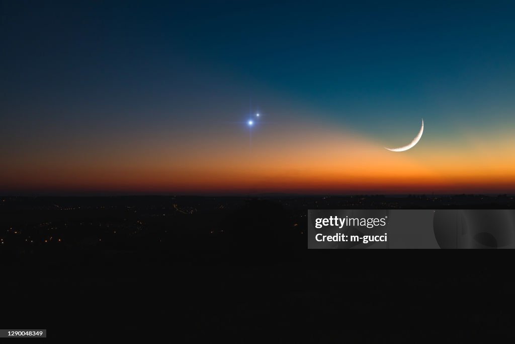 Astronomical conjunction of Saturn, Jupiter and Moon.
