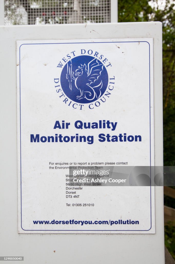 Sign on an air quality monitoring station in the village of Chideock in Dorset.