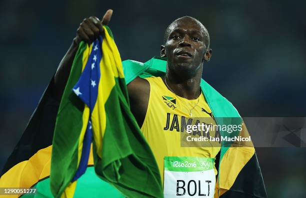 Usain Bolt of Jamaica celebrates after he wins Gold in the final of the Men's 200m on Day 13 of the Rio 2016 Olympic Games at the Olympic Stadium on...