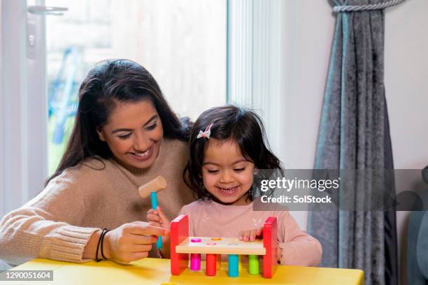 early learning - indian mother and child stock pictures, royalty-free photos & images