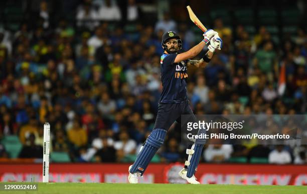 Virat Kohli of India hits a four during game three of the Twenty20 International series between Australia and India at Sydney Cricket Ground on...