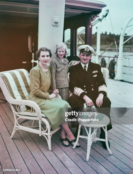 King Frederick IX of Denmark seated with Queen Ingrid , Queen consort of Denmark and their daughter Princess Margrethe aboard the Royal Yacht HDMY...