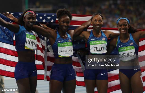 English Gardner, Allyson Felix, Tianna Bartoletta and Tori Bowie of the United States celebrate winning gold in the Women's 4 x 100m Relay Final on...
