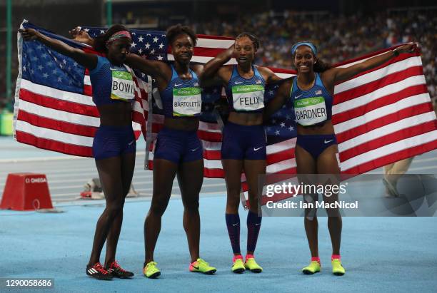 English Gardner, Allyson Felix, Tianna Bartoletta and Tori Bowie of the United States celebrate winning gold in the Women's 4 x 100m Relay Final on...