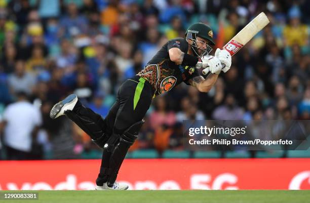 Matthew Wade of Australia hits out during game three of the Twenty20 International series between Australia and India at Sydney Cricket Ground on...