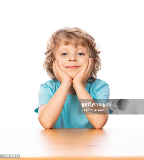 4 years old happy child by the table - 4 5 years stock pictures, royalty-free photos & images