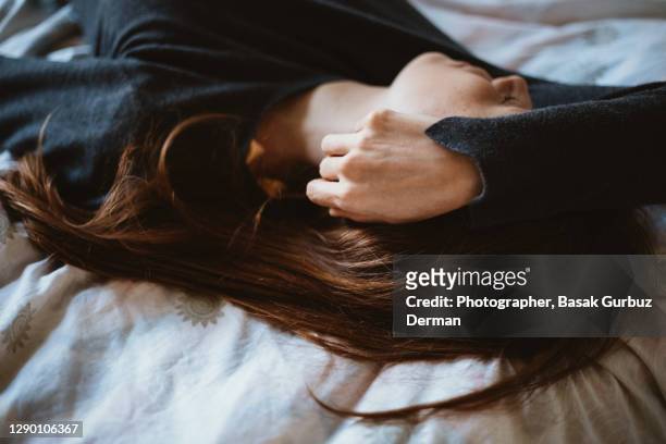 a woman sleeping - woman head in hands sad stock pictures, royalty-free photos & images