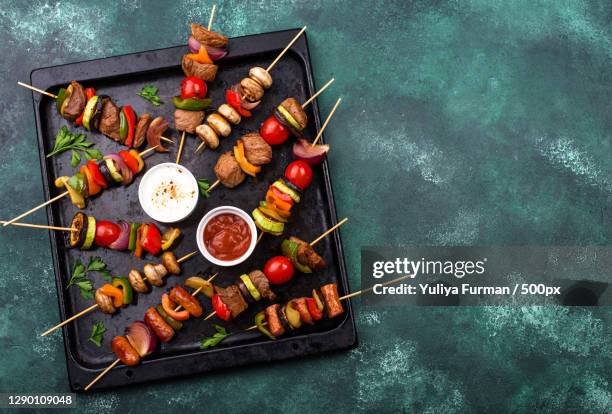 high angle view of food on barbecue grill - skewer stock pictures, royalty-free photos & images