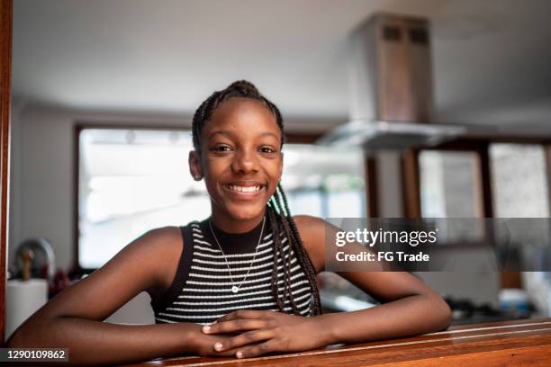 portrait of a teenager girl at home - 13 year old black girl stock pictures, royalty-free photos & images