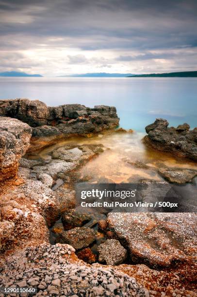 scenic view of sea against sky - pedra rocha ストックフォトと画像