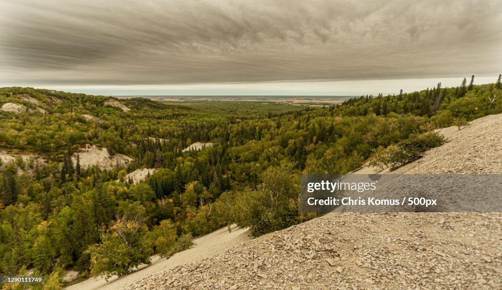 Scenic view of land against sky,Wasagaming Dr,Canada