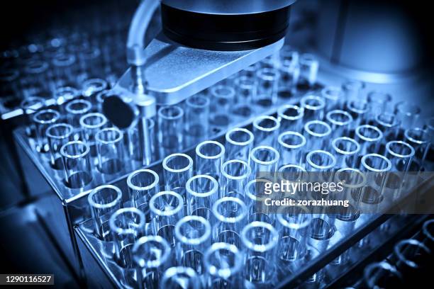 analyzing samples in test tube backgrounds - test tube stock pictures, royalty-free photos & images
