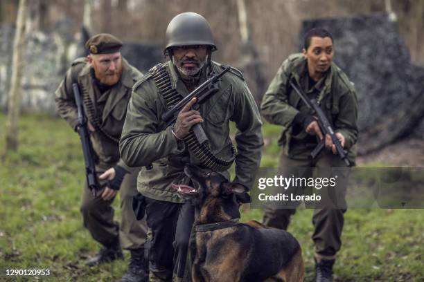 three soldiers during a military outdoor operation - army navy game stock pictures, royalty-free photos & images