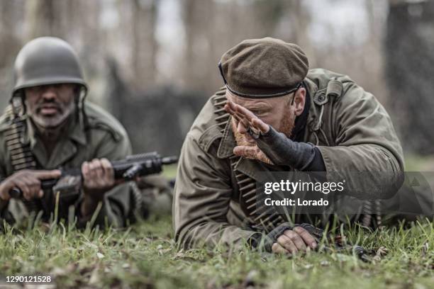 three soldiers during a military outdoor operation - army navy game stock pictures, royalty-free photos & images