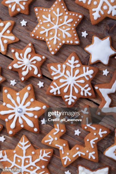 gingerbread christmas cookies full frame on wooden table. - sugar cookie stock pictures, royalty-free photos & images