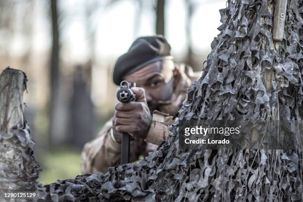 an individual military black male during an outdoor operation - reenactment stock pictures, royalty-free photos & images