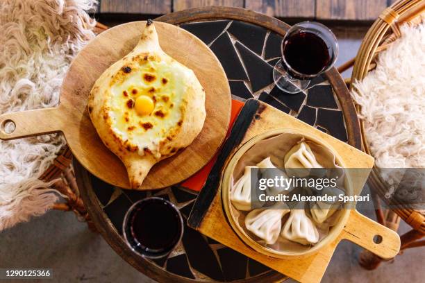 traditional georgian dinner with khachapuri and khinkali - tbilisi ストックフォトと画像