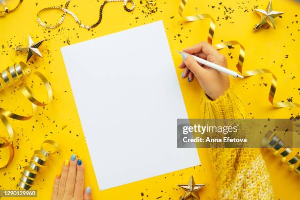 hands writing new year goals - 2021 resolutions stock pictures, royalty-free photos & images