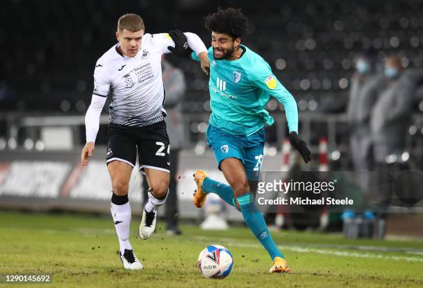 Jake Bidwell of Swansea City battles for the ball with Philip Billing of AFC Bournemouth during the Sky Bet Championship match between Swansea City...