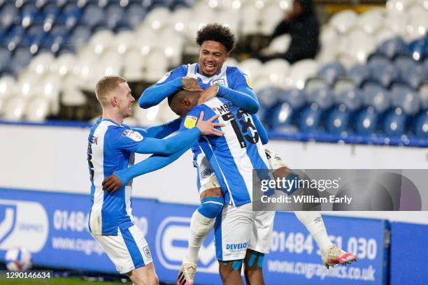 Isaac Mbenza of Huddersfield Town celebrates his goal with his teammates during the Sky Bet Championship match between Huddersfield Town and...