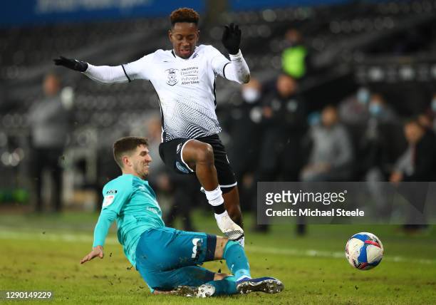 Jamal Lowe of Swansea City is challenged by Chris Mepham of AFC Bournemouth during the Sky Bet Championship match between Swansea City and AFC...
