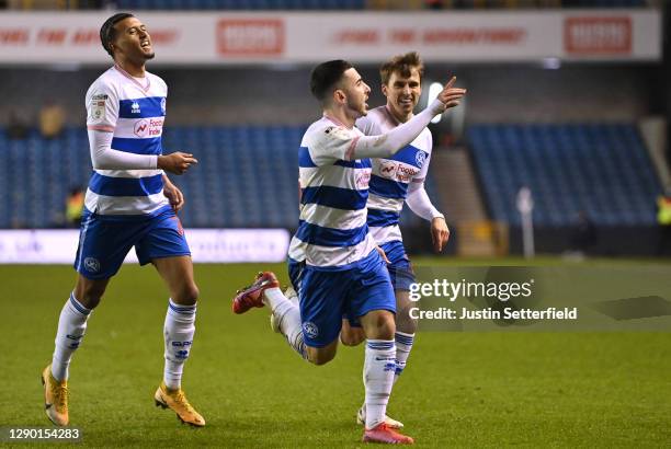 Ilias Chair of Queens Park Rangers celebrates with teammates Nicholas Hamalainen and Tom Carroll after scoring their sides first goal during the Sky...