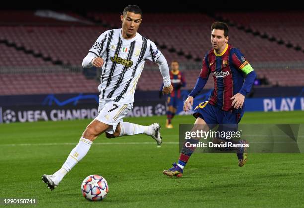 Cristiano Ronaldo of Juventus F.C. Is put under pressure by Lionel Messi of Barcelona during the UEFA Champions League Group G stage match between FC...