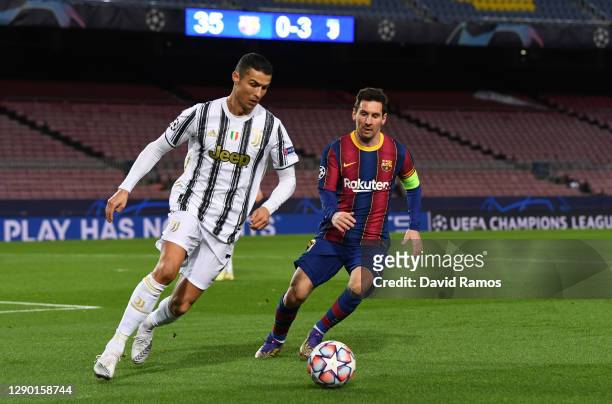 Cristiano Ronaldo of Juventus F.C. Is put under pressure by Lionel Messi of Barcelona during the UEFA Champions League Group G stage match between FC...