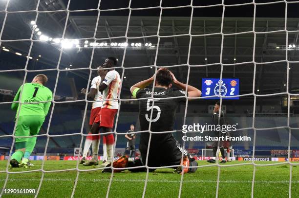 Harry Maguire of Manchester United reacts after missing a goal scoring chance during the UEFA Champions League Group H stage match between RB Leipzig...