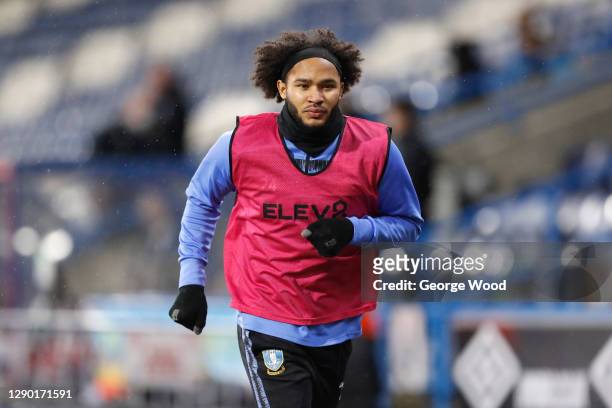 Izzy Brown of Sheffield Wednesday warms up on the sideline during the Sky Bet Championship match between Huddersfield Town and Sheffield Wednesday at...