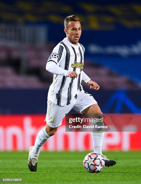 Arthur Melo of Juventus runs with the ball during the UEFA Champions League Group G stage match between FC Barcelona and Juventus at Camp Nou on...